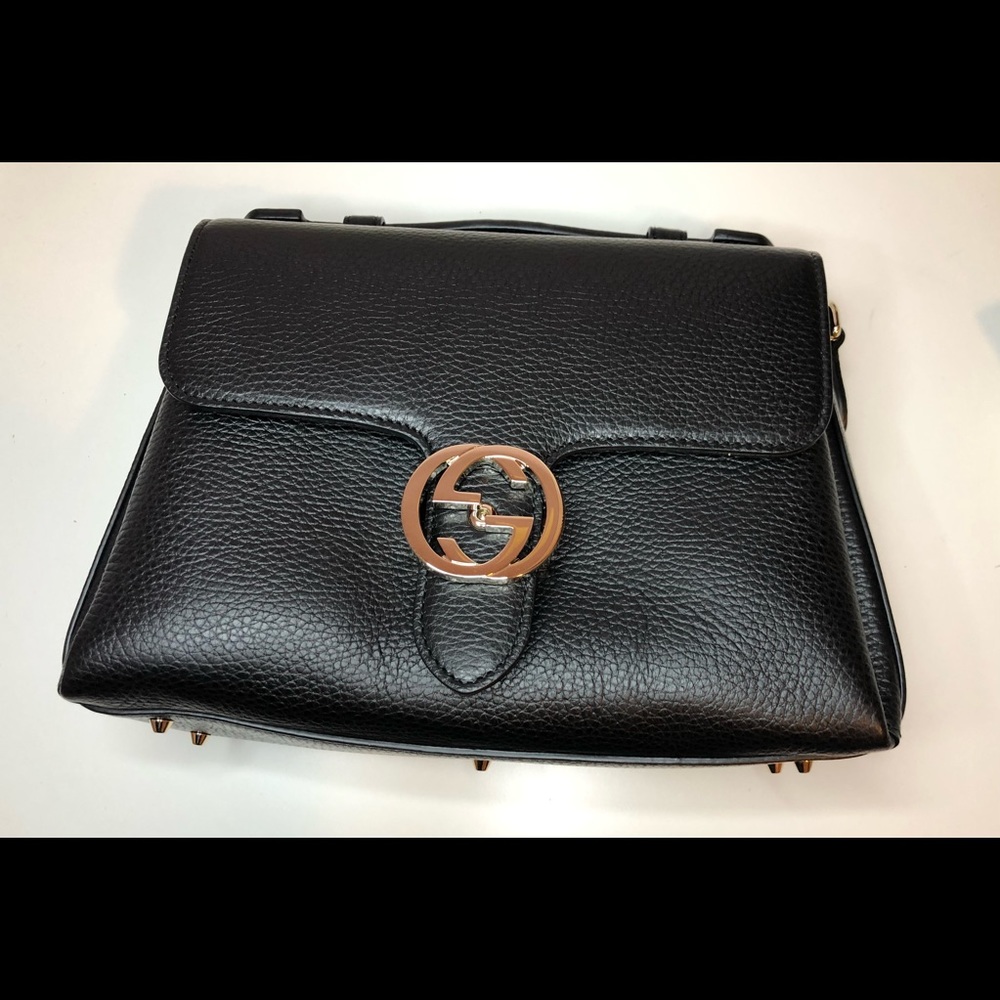 Gucci black dollar calfskin interlocking G top handle shoulder bag.
